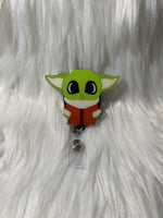 Green alien badge reel